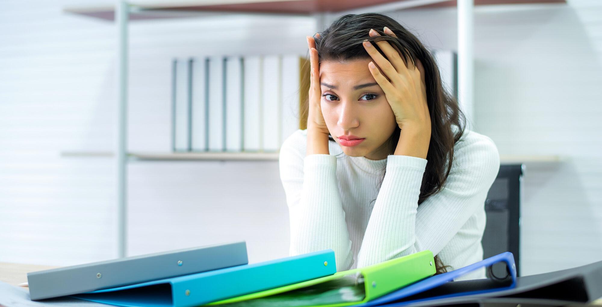 A female employee looking bored and fed-up