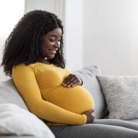 Pregnant lady sitting on sofa