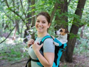 Woman walking with dog in forest -Healthy Work-Life Balance